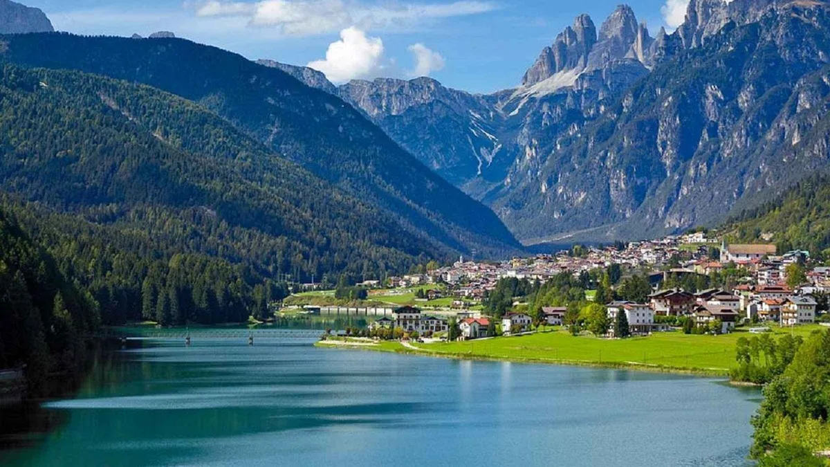 Lake Santa Caterina at Auronzo di Cadore, with the town and steep peaks behind