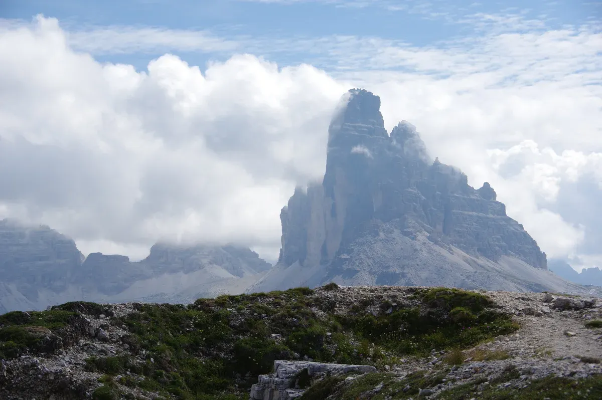 The Tre Cime di Lavaredo seen from the plateau of Monte Piana, with cloud around the summits